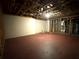 Spacious unfinished basement with exposed ceiling beams and a concrete floor, offering potential for customization at 3650 Deep Cove Dr, Cumming, GA 30041