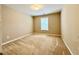 Carpeted bedroom featuring a window for natural light at 3650 Deep Cove Dr, Cumming, GA 30041