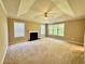 Spacious carpeted bedroom with tray ceiling, ceiling fan, fireplace and lots of natural light at 3650 Deep Cove Dr, Cumming, GA 30041