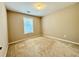 Carpeted bedroom with a window, neutral color, and natural light at 3650 Deep Cove Dr, Cumming, GA 30041