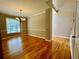 Dining room featuring hardwood floors, stylish chandelier, and natural light at 3650 Deep Cove Dr, Cumming, GA 30041