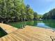 Beautiful lake view from the private dock, perfect for swimming, boating, and enjoying the outdoors at 3650 Deep Cove Dr, Cumming, GA 30041
