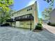 Rear view of a two-story home featuring an attached garage and private balconies, adding curb appeal at 3650 Deep Cove Dr, Cumming, GA 30041