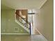 Spacious foyer featuring hardwood floors, staircase with white railings, and ample natural light at 3650 Deep Cove Dr, Cumming, GA 30041