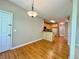 Hardwood floors in kitchen dining area with view of kitchen appliances at 3650 Deep Cove Dr, Cumming, GA 30041