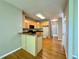 Spacious kitchen with hardwood floors and view of island at 3650 Deep Cove Dr, Cumming, GA 30041