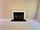 Cozy living room with a classic fireplace, neutral carpet, and a white mantel for a refined touch at 3650 Deep Cove Dr, Cumming, GA 30041