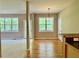 Spacious living room with hardwood floors, large windows, and views to the outside at 3650 Deep Cove Dr, Cumming, GA 30041