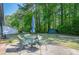 Backyard patio with outdoor seating and umbrella, perfect for entertaining guests at 554 Cana Of Galilee Ct, Tucker, GA 30084