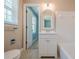 Bright bathroom with tiled flooring and an updated vanity at 554 Cana Of Galilee Ct, Tucker, GA 30084