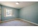 Inviting bedroom with a window providing ample natural light at 554 Cana Of Galilee Ct, Tucker, GA 30084