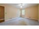 Bright bedroom featuring neutral walls, carpet and single window at 554 Cana Of Galilee Ct, Tucker, GA 30084