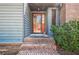 View of front porch steps and red door at 554 Cana Of Galilee Ct, Tucker, GA 30084