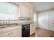 Kitchen area featuring granite countertops, white cabinets, and stainless steel dishwasher at 554 Cana Of Galilee Ct, Tucker, GA 30084