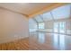 Bright and spacious living room with exposed beams, ceiling fan and access to outdoors at 554 Cana Of Galilee Ct, Tucker, GA 30084