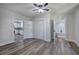Bedroom leading to kitchen and bathroom, featuring hardwood floors and closet at 899 Marshall Fuller Rd, Dallas, GA 30157