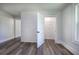 Bedroom with new floors, shiplap walls and open closet at 899 Marshall Fuller Rd, Dallas, GA 30157