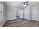 Bright bedroom features new floors, a ceiling fan, a closet and an open doorway at 899 Marshall Fuller Rd, Dallas, GA 30157