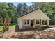 Charming single-story home featuring a welcoming front porch and picturesque wooded surroundings at 899 Marshall Fuller Rd, Dallas, GA 30157