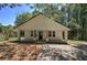 Inviting single-story home with a covered front porch, accented by wooden pillars, nestled in a serene setting at 899 Marshall Fuller Rd, Dallas, GA 30157