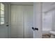 Hallway with closet, door to the outside and view of the bathroom at 899 Marshall Fuller Rd, Dallas, GA 30157