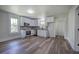 Modern kitchen features new cabinets, backsplash, stainless appliances, and an open layout at 899 Marshall Fuller Rd, Dallas, GA 30157