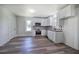Modern kitchen with white cabinets, stainless steel appliances and starburst backsplash at 899 Marshall Fuller Rd, Dallas, GA 30157