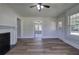 Cozy living room featuring a fireplace and views into the house from the large windows and an open layout at 899 Marshall Fuller Rd, Dallas, GA 30157