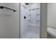 Close up of a shower with black fixtures and white molded plastic insert at 899 Marshall Fuller Rd, Dallas, GA 30157