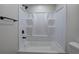 Close up of shower-tub combo featuring black fixtures and molded white insert at 899 Marshall Fuller Rd, Dallas, GA 30157