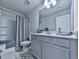 Well-lit bathroom with shower, tub, and modern vanity at 130 Maple Creek Way, Woodstock, GA 30188