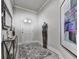 Stylish entryway featuring wood-look floors, elegant decor, and neutral paint colors for a welcoming ambiance at 130 Maple Creek Way, Woodstock, GA 30188