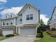 Charming two-story home with a brick and siding exterior, a two-car garage, and well-manicured landscaping at 130 Maple Creek Way, Woodstock, GA 30188