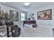 Inviting home office with a classic desk, comfortable seating, and natural light at 130 Maple Creek Way, Woodstock, GA 30188
