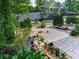 Beautiful landscaping and stone walkway with plants, flowers, shrubs, and ground cover at 130 Maple Creek Way, Woodstock, GA 30188