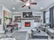 Cozy living room features a fireplace, built-in shelving, and comfortable seating at 130 Maple Creek Way, Woodstock, GA 30188