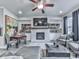 Cozy living room features a fireplace, built-in shelving, and comfortable seating at 130 Maple Creek Way, Woodstock, GA 30188