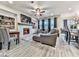 Inviting living room features a fireplace, built-in shelving, comfortable seating, and an open floor plan at 130 Maple Creek Way, Woodstock, GA 30188