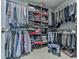 Well-organized walk-in closet with ample shelving and hanging space for storage at 130 Maple Creek Way, Woodstock, GA 30188