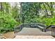 Backyard deck surrounded by lush trees at 2302 Colonial Ne Dr, Brookhaven, GA 30319