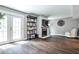 Bright living room featuring hardwood floors, a fireplace, and ample natural light at 2302 Colonial Ne Dr, Brookhaven, GA 30319