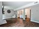 Open living room featuring hardwood floors and dining area at 2302 Colonial Ne Dr, Brookhaven, GA 30319