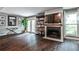 Bright living room with fireplace, updated flooring and french doors to outside at 2302 Colonial Ne Dr, Brookhaven, GA 30319