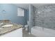 Elegant bathroom with granite countertop, updated fixtures, and a contemporary tiled shower at 4175 Danforth Sw Rd, Atlanta, GA 30331