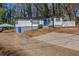 Charming home featuring white siding, a blue door, and a convenient carport with ample driveway space at 4175 Danforth Sw Rd, Atlanta, GA 30331