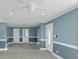 Spacious living area with neutral paint, white trim, and a ceiling fan for added comfort at 4175 Danforth Sw Rd, Atlanta, GA 30331