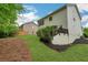 Large backyard featuring lush grass, a gentle slope, and tasteful landscaping at 4240 Spring Rdg, Cumming, GA 30028