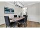 Elegant dining room with modern light fixture, stylish decor, and an open layout at 4240 Spring Ridge Dr, Cumming, GA 30028