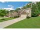Charming two-story home with a well-manicured lawn and a long driveway leading to an attached two-car garage at 4240 Spring Ridge Dr, Cumming, GA 30028