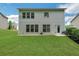 Large, level backyard featuring lush lawn, patio, and landscaped areas, ideal for outdoor activities at 4240 Spring Ridge Dr, Cumming, GA 30028